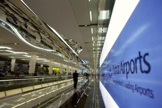 A man walks towards the departure lounge at Dubai International Airport's Terminal 3 on October 9, 2008.