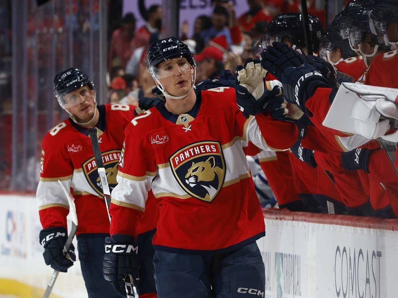 Gustav Forsling of the Florida Panthers skates by the team bench and celebrates with teammates after scoring a first period goal against the Toronto Maple Leafs at Amerant Bank Arena on Tuesday, April 8, 2025, in Sunrise, Fla.
