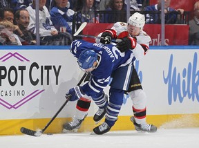 Brady Tkachuk #7 of the Ottawa Senators hits Scott Laughton #24 of the Toronto Maple Leafs in the second period of Game One of the First Round of the 2025 Stanley Cup Playoffs at Scotiabank Arena on April 20, 2025 in Toronto. (Photo by Claus Andersen/Getty Images)