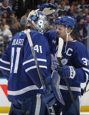 Auston Matthews #34 of the Toronto Maple Leafs congratulates teammate Anthony Stolarz #41 on his victory against the Ottawa Senators in Game One of the First Round of the 2025 Stanley Cup Playoffs at Scotiabank Arena on April 20, 2025 in Toronto.