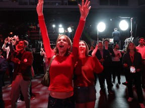 Supporters for Liberal Leader Mark Carney celebrate as results are announced.