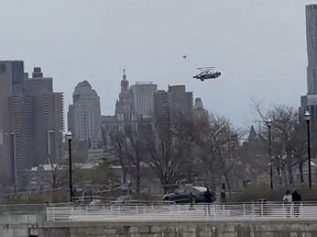 In this photo taken from video, a helicopter falls from the sky into the Hudson River , Thursday, April 10, 2025, in Jersey City, N.J.