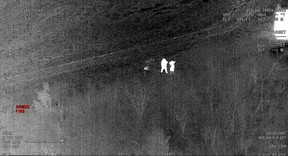 This image from a video recorded by an OPP helicopter's thermal imaging camera shows Brandi Stewart-Sperry surrendering to police after Haldimand OPP Const. Greg Pierzchala was shot to death on Dec. 22, 2022.