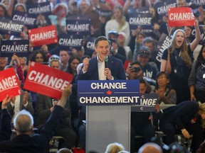 Pierre Poilievre and his wife rally with hundreds of supporters in Calgary on Friday, April 25, 2025.