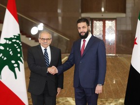 Lebanese Prime Minister Nawaf Salam shook hands with Syria's interim President Ahmad al-Sharaa.
