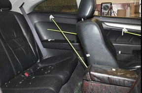 An evidence image shown to the trial in the death of innocent victim Dante Andreatta, 12. Toronto Forensics garage showing the recovered Honda Accord involved in the shootout. Forensic images show bullet holes in car, recovered bullet fragments, blood in interior of car and direction of shots fire at and into car.