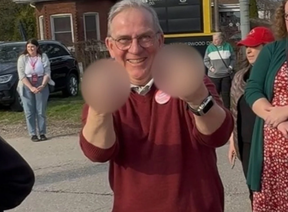 A Liberal supporter, Matt Janes from St. Thomas, gives two middle fingers to the camera outside an election rally in Brantford on Friday, April 19, 2025. Journalist and lawyer Caryma Sa’d posted the image to social media that has been edited to obscure the gesture. Sa'd said the photo was taken in an interaction between Janes and her videographer.