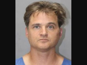Booking photo of Gerhardt Konig, accused of trying to murder wife by pushing her off cliff in Oahu, Hawaii.