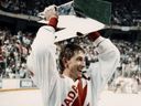 Team Canada's captain Wayne Gretzky hoists the Canada Cup trophy at Copps Coliseum in Hamilton Ont., on Sept. 15, 1987.