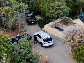 Law enforcement officials talk outside the home of actor Gene Hackman on Feb. 27, 2025 in Santa Fe, New Mexico.