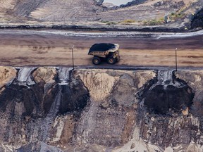 A heavy hauler truck drives through an oilsands mine near Fort McMurray, Alta.
