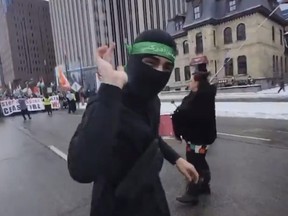 Anti-Israel activist in Ottawa, On. wearing a unform associated with the terrorist group Hamas, on Sunday, March 29 2025.