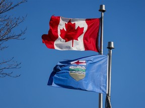 The Canadian flag and an Alberta flag.