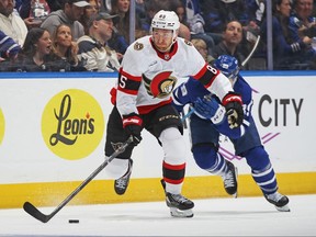 Jake Sanderson of the Ottawa Senators skates with the puck.