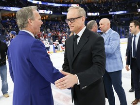 Jon Cooper and Paul Maurice shake hands.