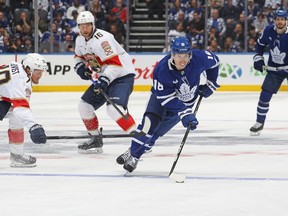 Mitchell Marner #16 of the Toronto Maple Leafs skates with the puck past Jesper Boqvist #70 of the Florida Panthers during the second period in Game Five of the Second Round of the 2025 Stanley Cup Playoffs at Scotiabank Arena on May 14, 2025 in Toronto.
