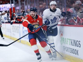 Matthew Tkachuk #19 of the Florida Panthers and Simon Benoit #2 of the Toronto Maple Leafs look on during the first period in Game Four of the Second Round of the 2025 Stanley Cup Playoffs at Amerant Bank Arena on May 11, 2025 in Sunrise, Florida.