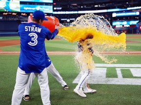 Daulton Varsho is doused with Gatorade.
