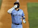 Bo Bichette of the Toronto Blue Jays celebrates after hitting a double home run against the Texas Rangers during the ninth inning at Globe Life Field on May 28, 2025 in Arlington, Texas.