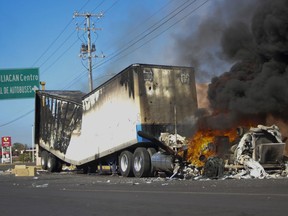 A truck burns on a street in Culiacan, Sinaloa state, Thursday, Jan. 5, 2023.