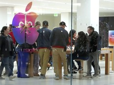 Shoppers look at Apple products