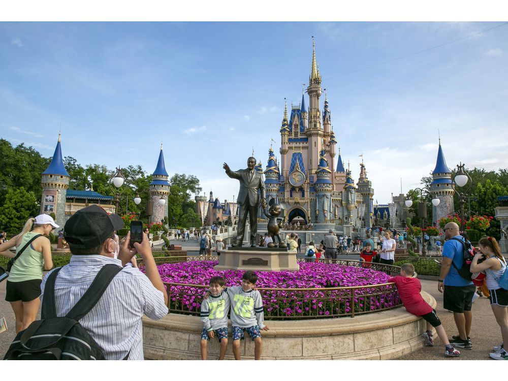 People visit the Magic Kingdom Park at Walt Disney World Resort in Lake Buena Vista, Fla., April 18, 2022. 