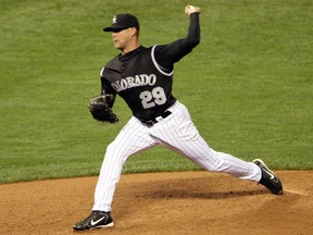 Dan Serafini, seen here pitching for the Colorado Rockies at Coors Field in Denver on Sept. 5, 2007, is accused of murdering his father-in-law and almost killing his mother-in-law.