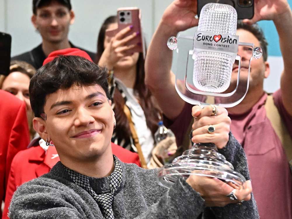 Austria welcomes Eurovision winner JJ back home with cheers, hugs and roses