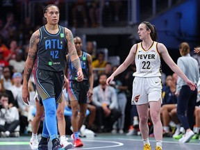 Brittney Griner #42 of the Atlanta Dream reacts after drawing a foul against Caitlin Clark #22 of the Indiana Fever during the third quarter at State Farm Arena on May 22, 2025 in Atlanta, Georgia.