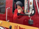 Mayor Olivia Chow hams it up for the cameras as two new electric Toronto Fire trucks are delivered.