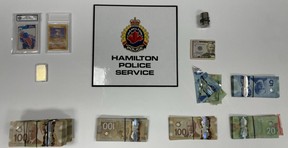 Hamilton Police said an estimated $60,000 to $70,000 in cash was seized as part of a drug trafficking investigation.