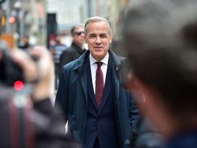 Prime Minister Mark Carney walks along Sparks St. in Ottawa, ON. on Friday, May 2, 2025.