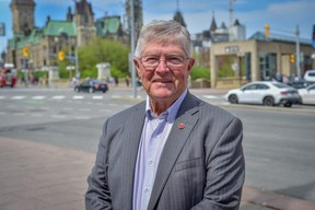 Sen. Don Plett, who retired this month from the Canadian Senate, stands on Wellington St. in downtown Ottawa, Ont. on Tuesday, May 13, 2025. Plett was the first president of the Conservative Party of Canada.