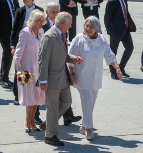 Governor General Mary Simon speaks with the King and Queen as they arrive in Ottawa on Monday