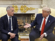 Donald Trump gestures at Mark Carney