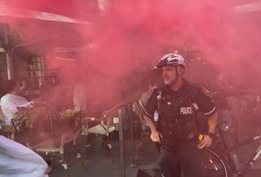 A Palestinian protest, in the context of a Nakba Day demonstration, passed by Cafe Landwer at University Ave. and Adelaide St. W. with protesters calling for a boycott of the Israeli restaurant chain and one protestor setting off a smoke bomb outside the restaurant on Thursday, May 15, 2025.