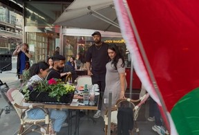 A Palestinian protest, in the context of a Nakba Day demonstration, passed by Cafe Landwer at University Ave. and Adelaide St. W. with protesters calling for a boycott of the Israeli restaurant chain and one protestor setting off a smoke bomb outside the restaurant on Thursday, May 15, 2025.