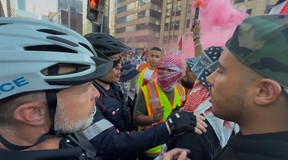 A Palestinian protest, in the context of a Nakba Day demonstration, passed by Cafe Landwer at University Ave. and Adelaide St. W. with protesters calling for a boycott of the Israeli restaurant chain and one protestor setting off a smoke bomb outside the restaurant on Thursday, May 15, 2025.