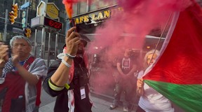 A Palestinian protest, in the context of a Nakba Day demonstration, passed by Cafe Landwer at University Ave. and Adelaide St. W. with protesters calling for a boycott of the Israeli restaurant chain and one protestor setting off a smoke bomb outside the restaurant on Thursday, May 15, 2025.