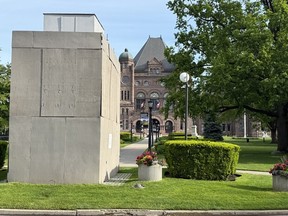 The statue of Sir John A. Macdonald covered at Queen's Park in Toronto. BRIAN LILLEY/TORONTO SUN