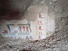 In this undated photo, hieroglyphs are revealed in the three new graves of senior statesmen found in the Dra' Abu al-Naga necropolis area in Luxor, Egypt.