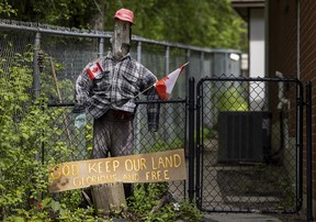 A scarecrow outside the home of a senior who was slain in her yard, allegedly by a 14-year-old boy the previous day in Pickering, Ont. on Friday, May 30, 2025. ERNEST DOROSZUK/TORONTO SUN