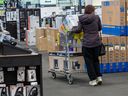 A shopper inside a Best Buy store during the 2024 holiday shopping season.