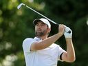 Scottie Scheffler plays a shot from the 16th tee during the final round of the Memorial Tournament.