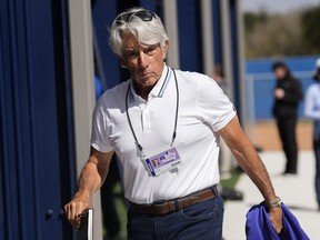 Toronto Blue Jays television analyst Buck Martinez watches a bullpen pitching session during spring training in 2023.