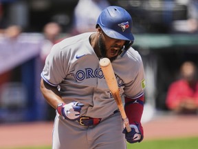 Toronto Blue Jays' Vladimir Guerrero Jr. reacts after being hit by a pitch against the Cleveland Guardians.