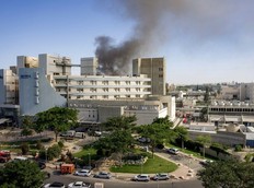 Smoke billows from a building at Soroka Hospital in Beersheba in southern Israel following an Iranian missile attack, on June 19, 2025.