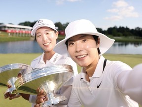 Jin Hee Im and Somi Lee of South Korea imitate a selfie.