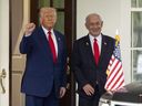 FILE - President Donald Trump, left, stands with Israel's Prime Minister Benjamin Netanyahu at the West Wing of the White House, April 7, 2025, in Washington.