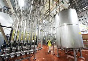 An employee overlooks plant operations during a plant tour at the Molson Coors Toronto Brewery in Toronto on Tuesday, May 27, 2025. THE CANADIAN PRESS/Nathan Denette